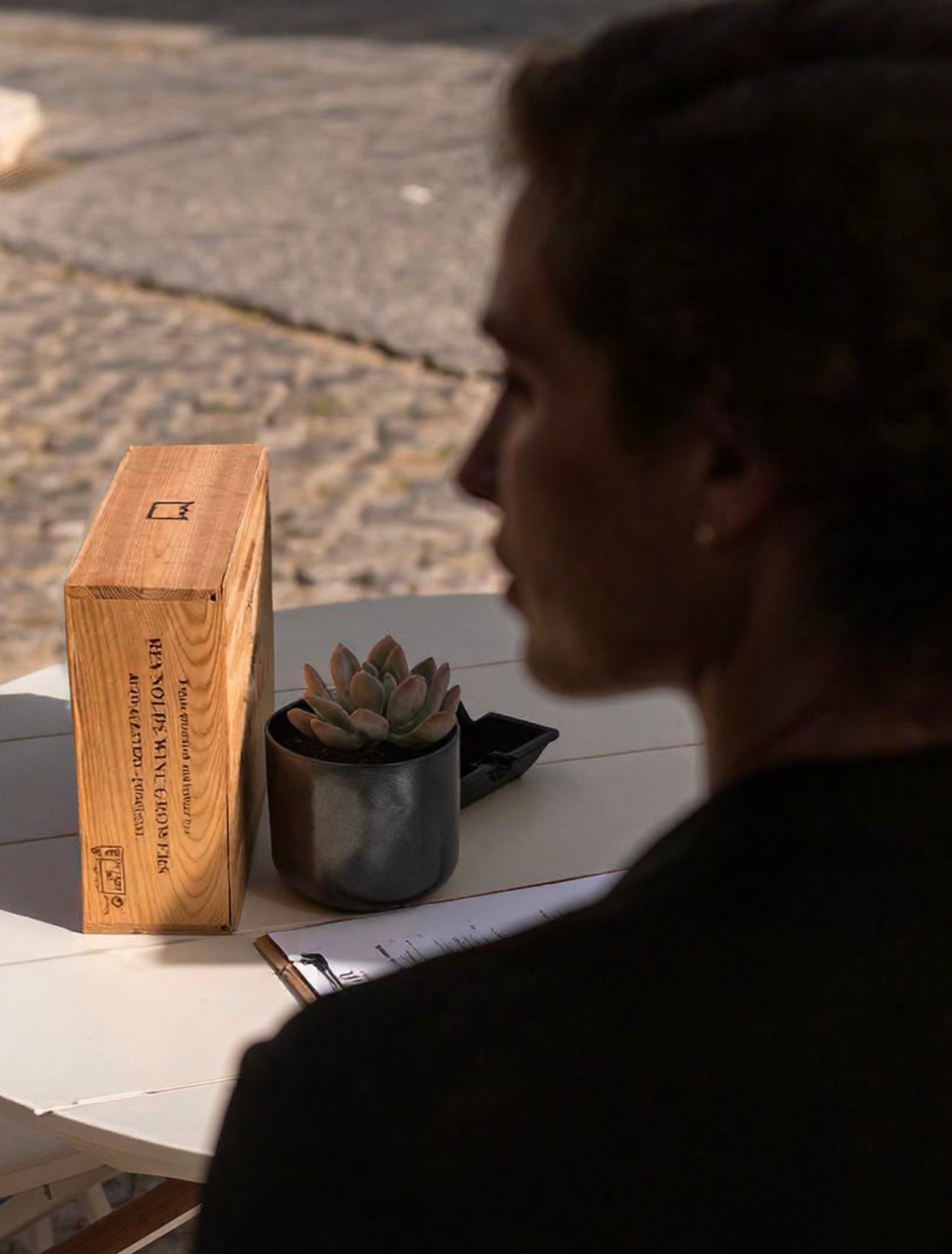 Guest enjoying wine on the Aura Tavira terrace